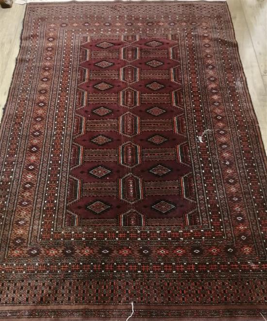 A Caucasian red ground rug 180 x 120cm